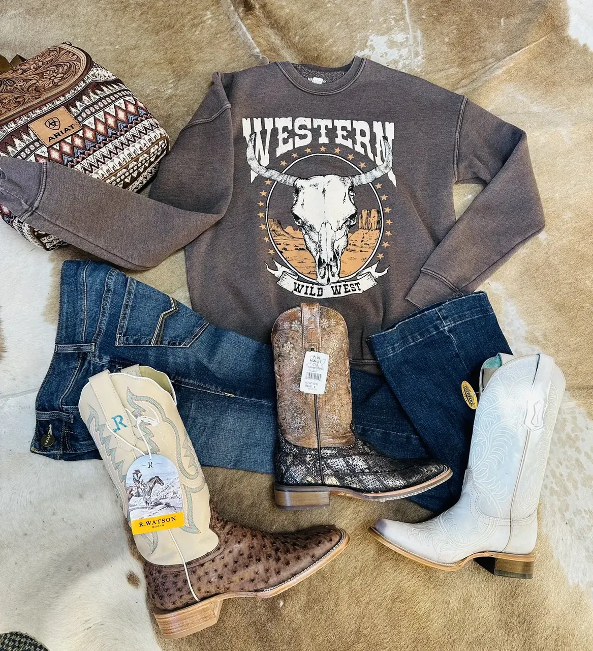 Western outfit with graphic tee, jeans and boots